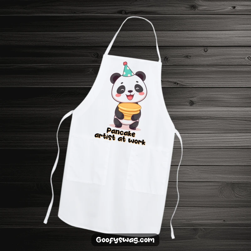 Funny beaming panda in a party hat balancing pancakes, a practical and humorous apron for kitchen fun.