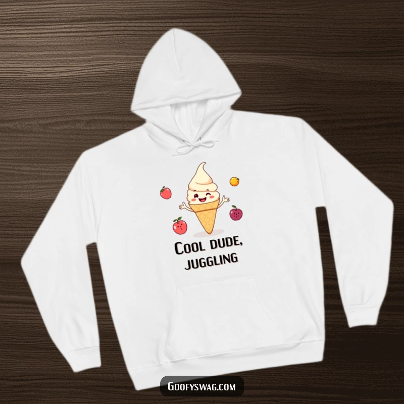Funny ice cream cone grinning and juggling small fruits, a cozy hoodie design that brings warmth, sweetness, and plenty of humor.