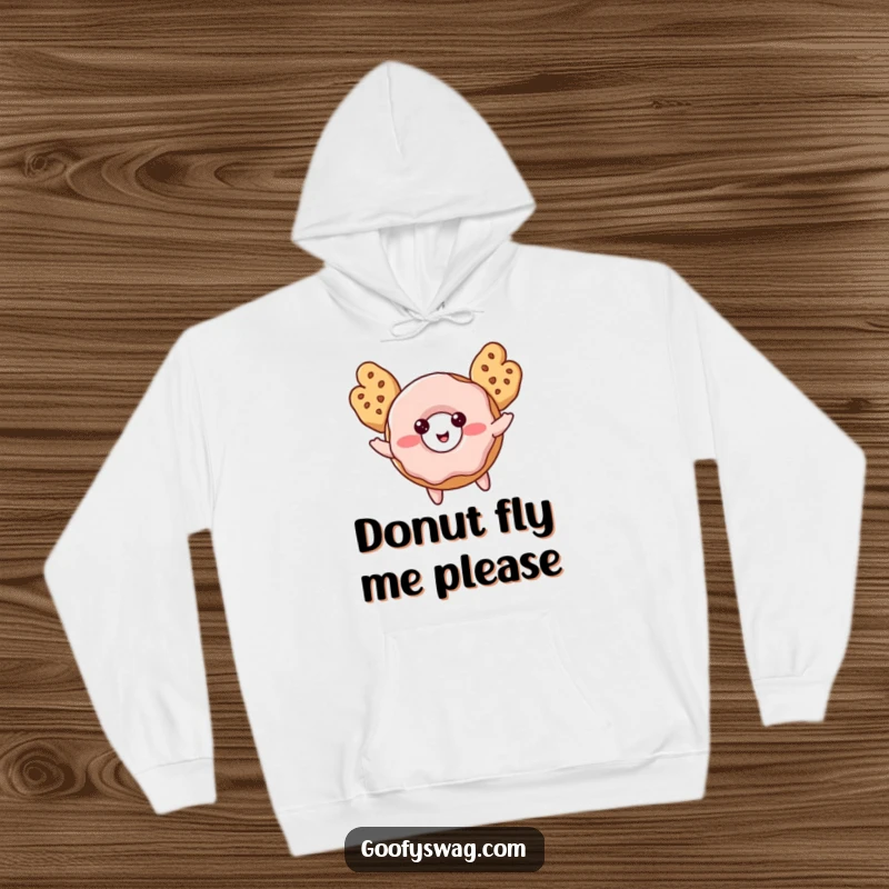 Funny Donut Hoodie with cookie wings, showing a blushing donut attempting flight, combining warmth with sugary humor.