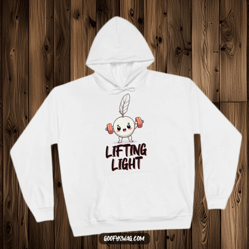 Funny determined dumbbell hoodie, showing effort against a feather, perfect for cozy gym humor.