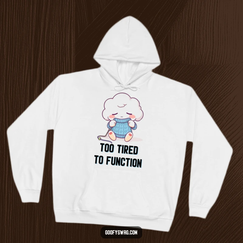 Funny sleepy cloud hoodie, depicted dozing off while holding knitting needles and yarn, perfect for cozy vibes.