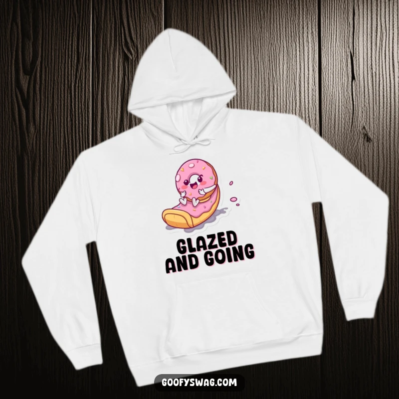 Funny Donut Slide Hoodie: A playful donut character zooming down a frosting slide is featured on this warm and humorous hoodie.
