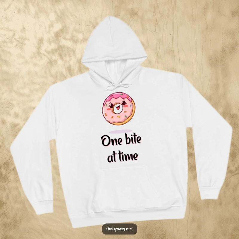 Funny hoodie featuring a wobbly jelly doughnut trying to balance on a single bite, perfect for cozy sweetness.