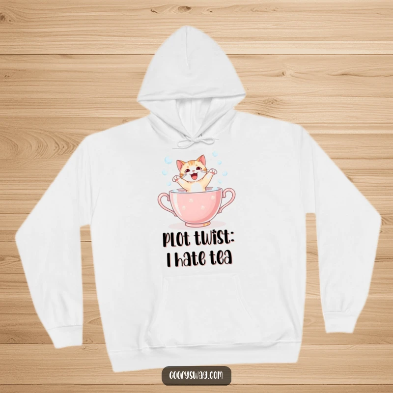 Funny startled cat bursting from a giant bubble-filled teacup, a cozy and humorous hoodie design for ultimate relaxation.