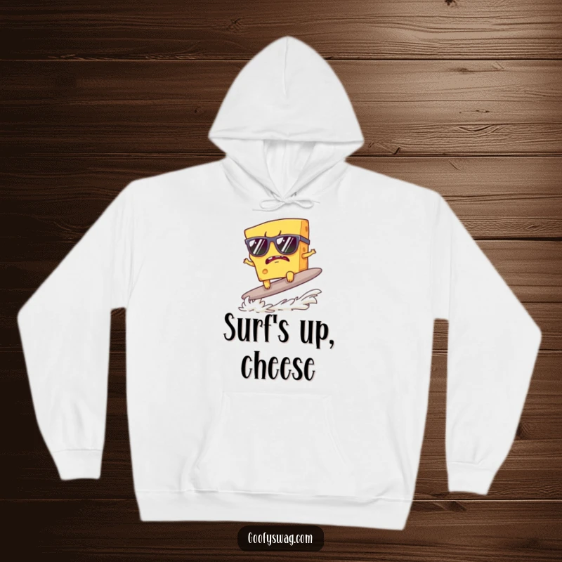 Funny hoodie featuring a grumpy cheese slice in sunglasses attempting to surf a cracker, perfect for cozy cool.