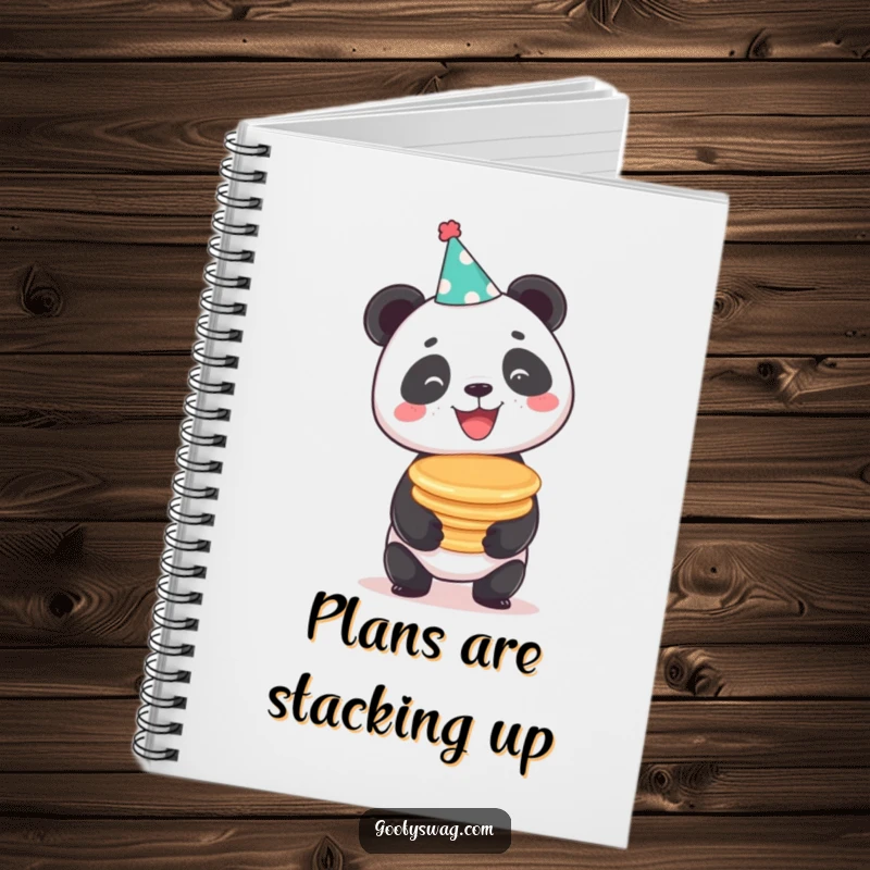Funny beaming panda balancing a stack of pancakes, a humorous notebook for creative minds and planners.