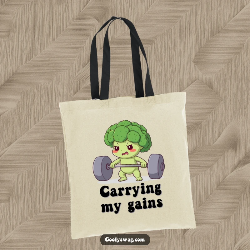 Funny tote bag featuring a determined broccoli floret straining to lift a heavy weight, perfect for carrying items with a healthy message.